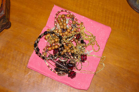 Picture of a tangle mound of necklaces